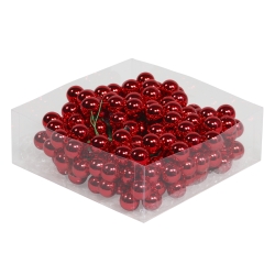A clear box filled with shiny red decorative balls, reflecting light beautifully.