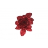 A sparkling red glitter flower with layered petals on a white background.