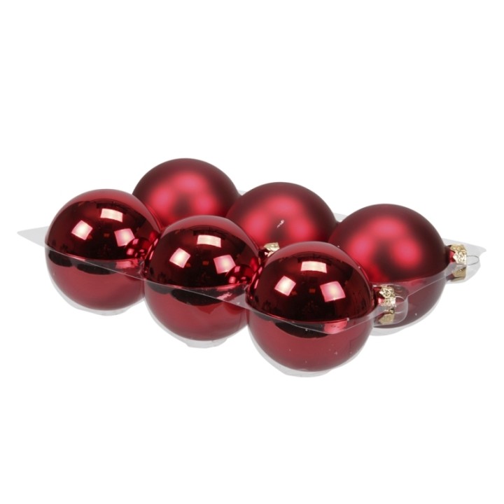 Zes glanzende, diepe rode kerstballen in een metalen houder.