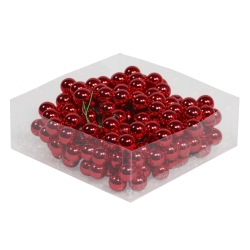 A clear box filled with shiny red decorative balls, reflecting light beautifully.