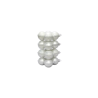 A vertical stack of glossy white spherical ornaments, reflecting light beautifully.