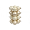 A stack of glossy cream-colored ornaments with a smooth, shiny finish.