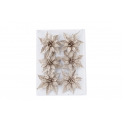 Six glittery flower ornaments with pointed petals arranged on a clear backing.