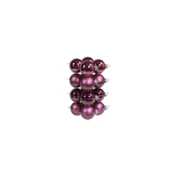 A stack of shiny, deep purple Christmas ornaments in various finishes.