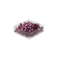 A clear box filled with glossy purple and magenta decorative pearls.