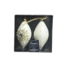 Two elegant, cream-colored Christmas ornaments in a clear box, adorned with gold accents.