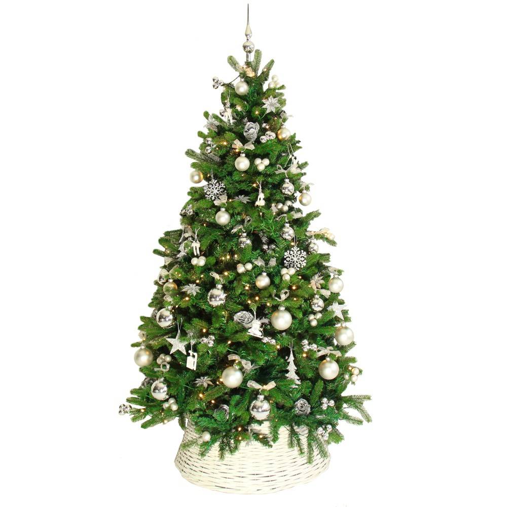 A lush green Christmas tree adorned with silver ornaments and a woven basket base.