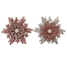 Two ornate brooches, one in shimmering red and the other in silver, each adorned with a central p...