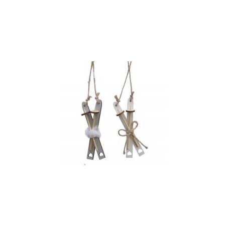 Two wooden ski decorations with twine, one adorned with a fluffy white pom-pom.