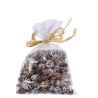 A clear bag filled with small pinecones tied with a golden ribbon.