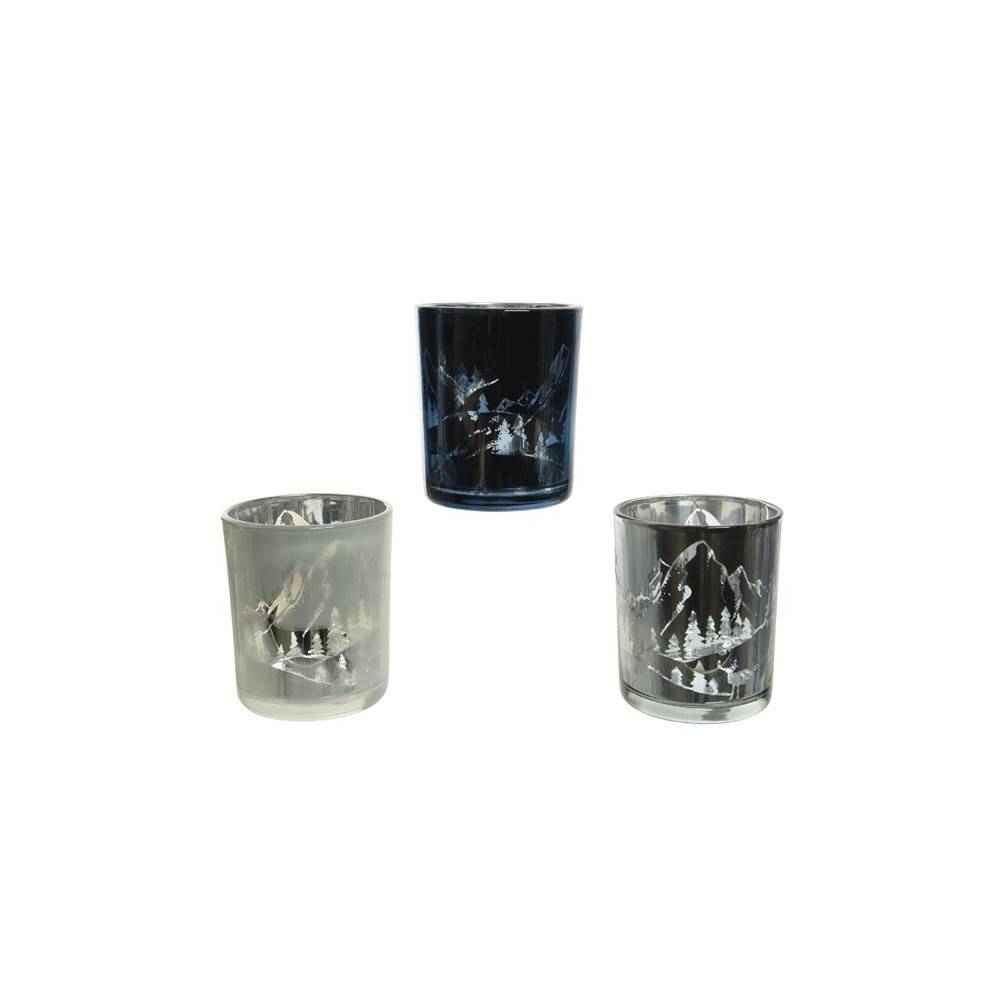 Three decorative glasses in varying shades of blue and clear, featuring etched mountain scenes.