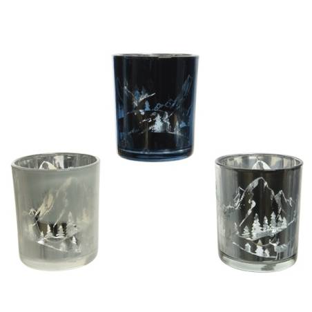 Three decorative glasses in varying shades of blue and clear, featuring etched mountain scenes. Three decorative glasses in varying shades of blue and clear, featuring etched mountain scenes.