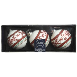 Drie witte kerstballen met rode en groene versieringen in een chique doos.