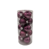 A clear cylindrical container filled with shiny purple Christmas ornaments.