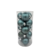 A clear cylindrical container filled with matte teal Christmas ornaments.