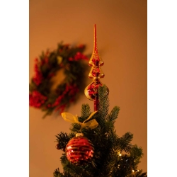 A festive Christmas tree adorned with red ornaments and a golden star topper, set against a wreath.