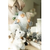 A cozy winter scene featuring a whimsical Santa with squirrels and pinecones.