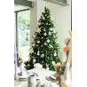 A beautifully decorated Christmas tree adorned with white ornaments and silver accents.