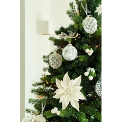 A beautifully decorated Christmas tree with silver and white ornaments and a large white flower.