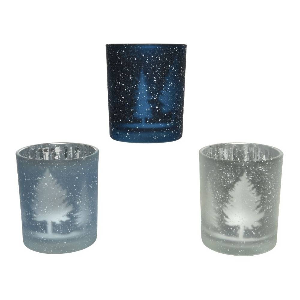 Frosted glass candle holders with snowy trees, in shades of blue and white.