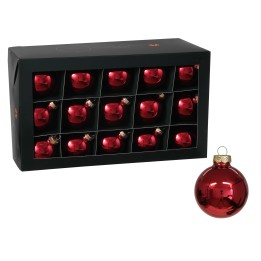 Een zwarte doos met vijftien glanzende, rode kerstballen, één los naast de doos.