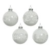 Four clear glass ornaments with intricate white winter scenes and silver tops.