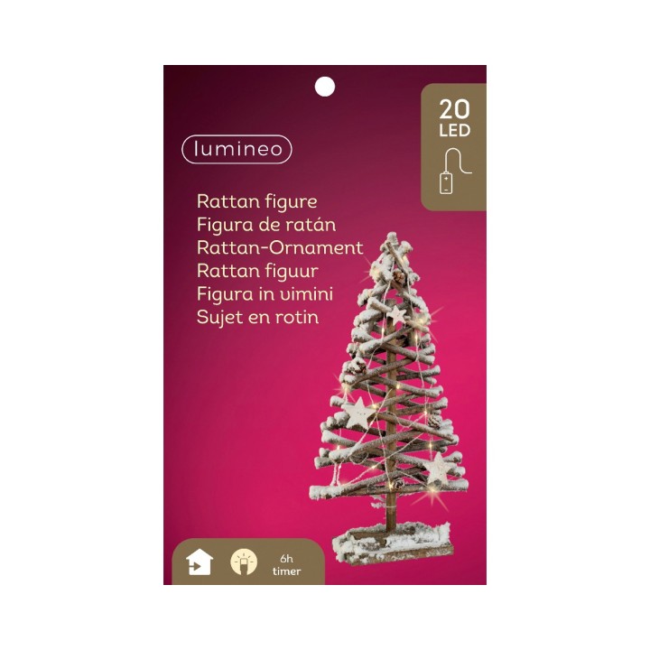 Klein rieten kerstboompje met LED-lampjes, op een roze achtergrond, sfeervol en decoratief.
