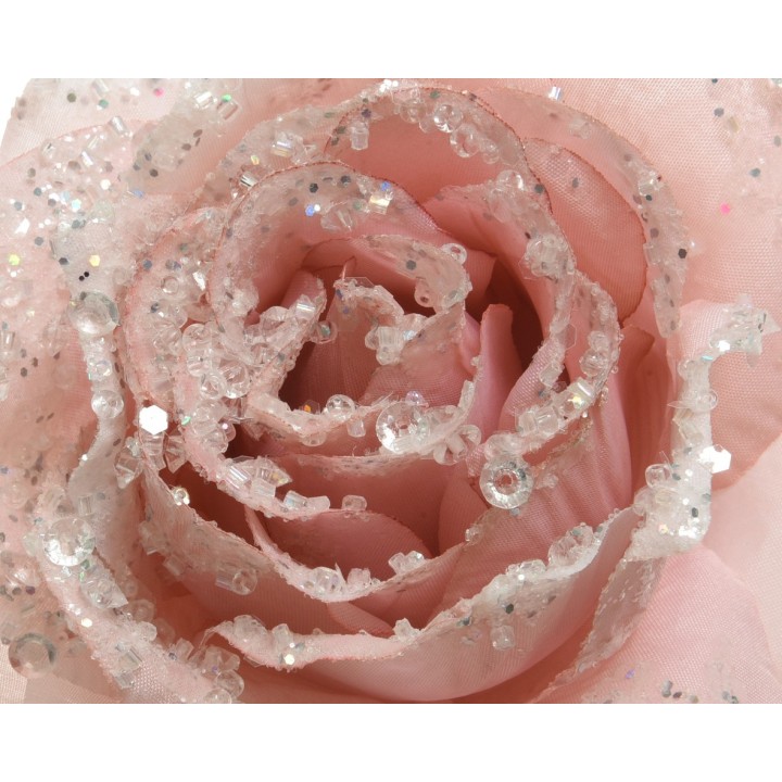 A delicate pink rose adorned with shimmering crystals and glitter, exuding elegance.