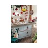 A cozy kitchen adorned with festive decorations, featuring a charming wooden countertop and color... A cozy kitchen adorned with festive decorations, featuring a charming wooden countertop and color...