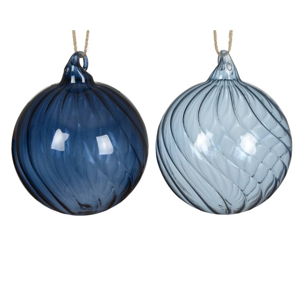 Two glass ornaments, one dark blue with swirls and one light blue, both shiny and round.