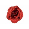 A vibrant red rose covered in shimmering glitter, showcasing intricate petal details.