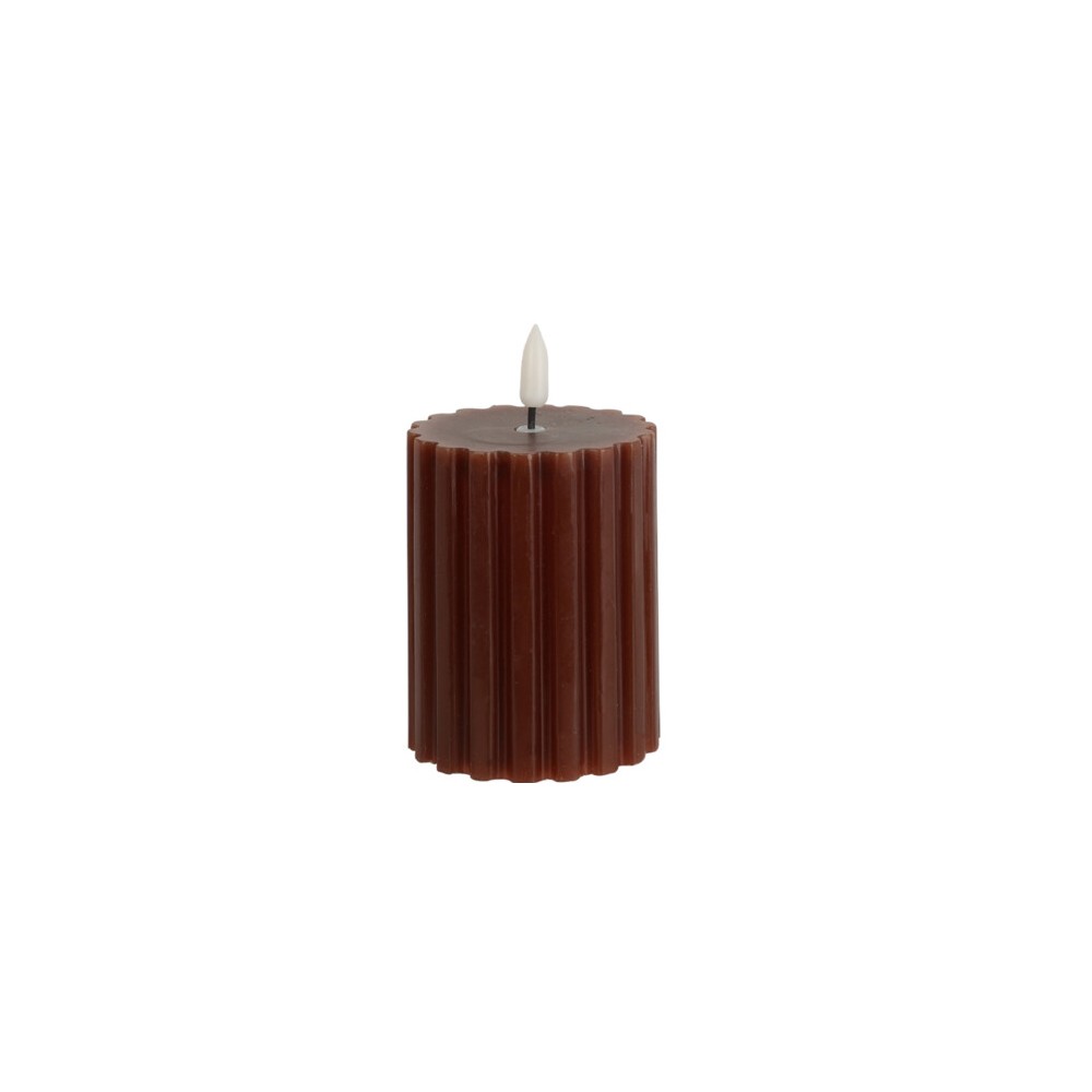 A tall, ribbed candle in deep brown with a small white wick on top.
