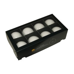 A sleek black box containing nine smooth, white spherical objects arranged neatly.