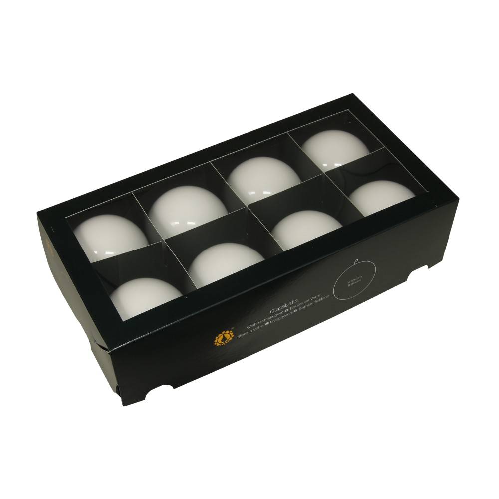 A sleek black box containing nine smooth, white spherical objects arranged neatly.