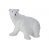 A smooth, white polar bear figurine with gentle features and a rounded, friendly posture.