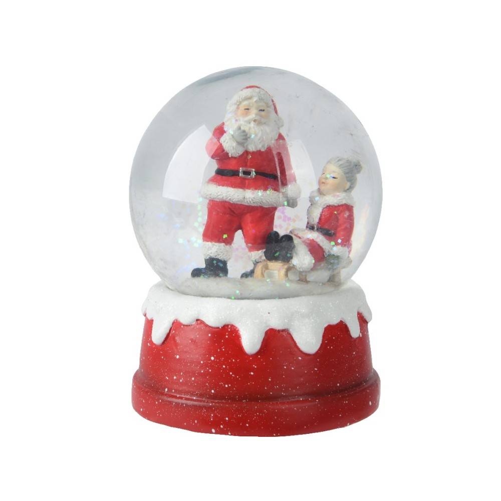 A snow globe featuring Santa Claus and a child inside, set on a red, snowy base.