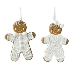 Two decorated gingerbread cookies shaped like dolls, adorned with white icing and smiling faces.