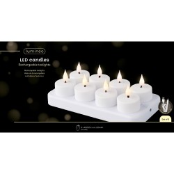 Set van acht witte LED-theelichten op een witte houder, met een warme gloed en moderne uitstraling.