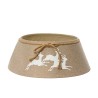 A beige fabric tree skirt with white leaping deer and a tied rope detail.