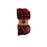 A cozy red and black plaid blanket rolled up, tied with a simple brown label.