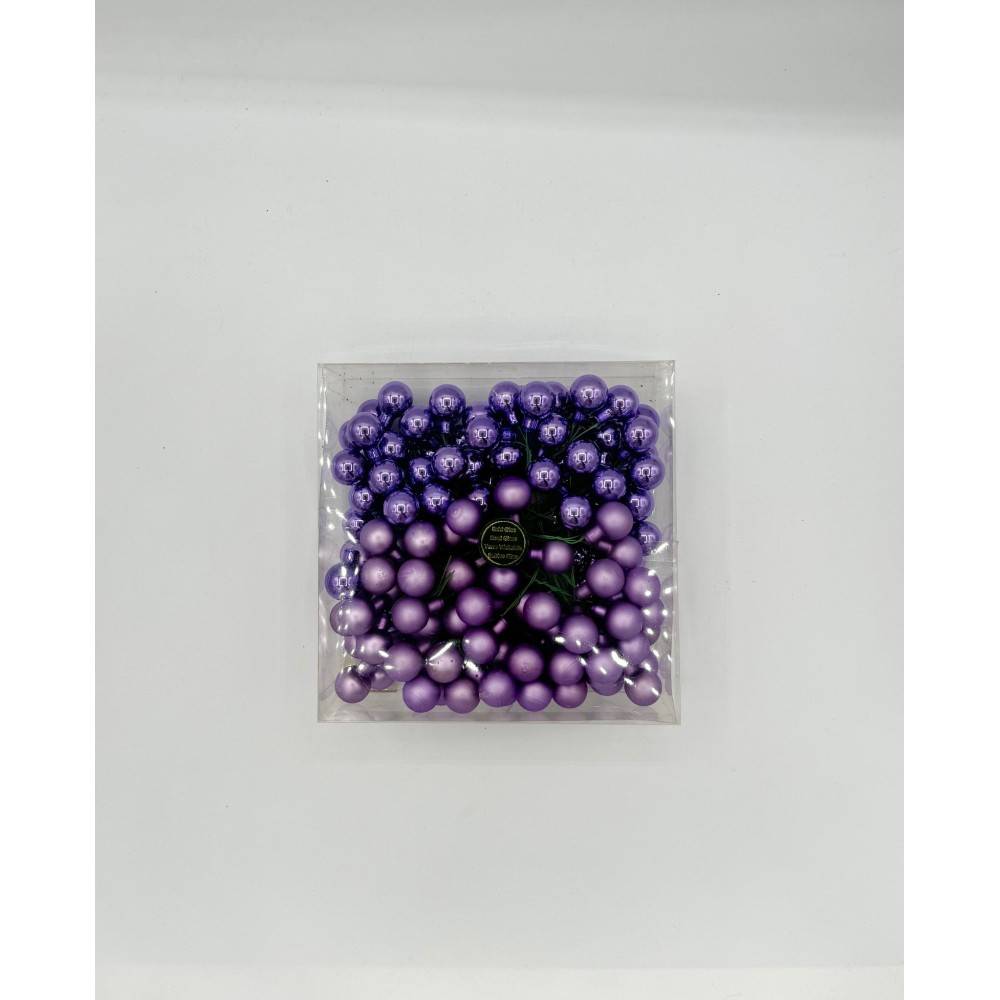 A clear container filled with various shades of purple decorative balls.