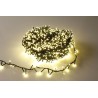 A tangled bundle of warm white fairy lights on a light background.