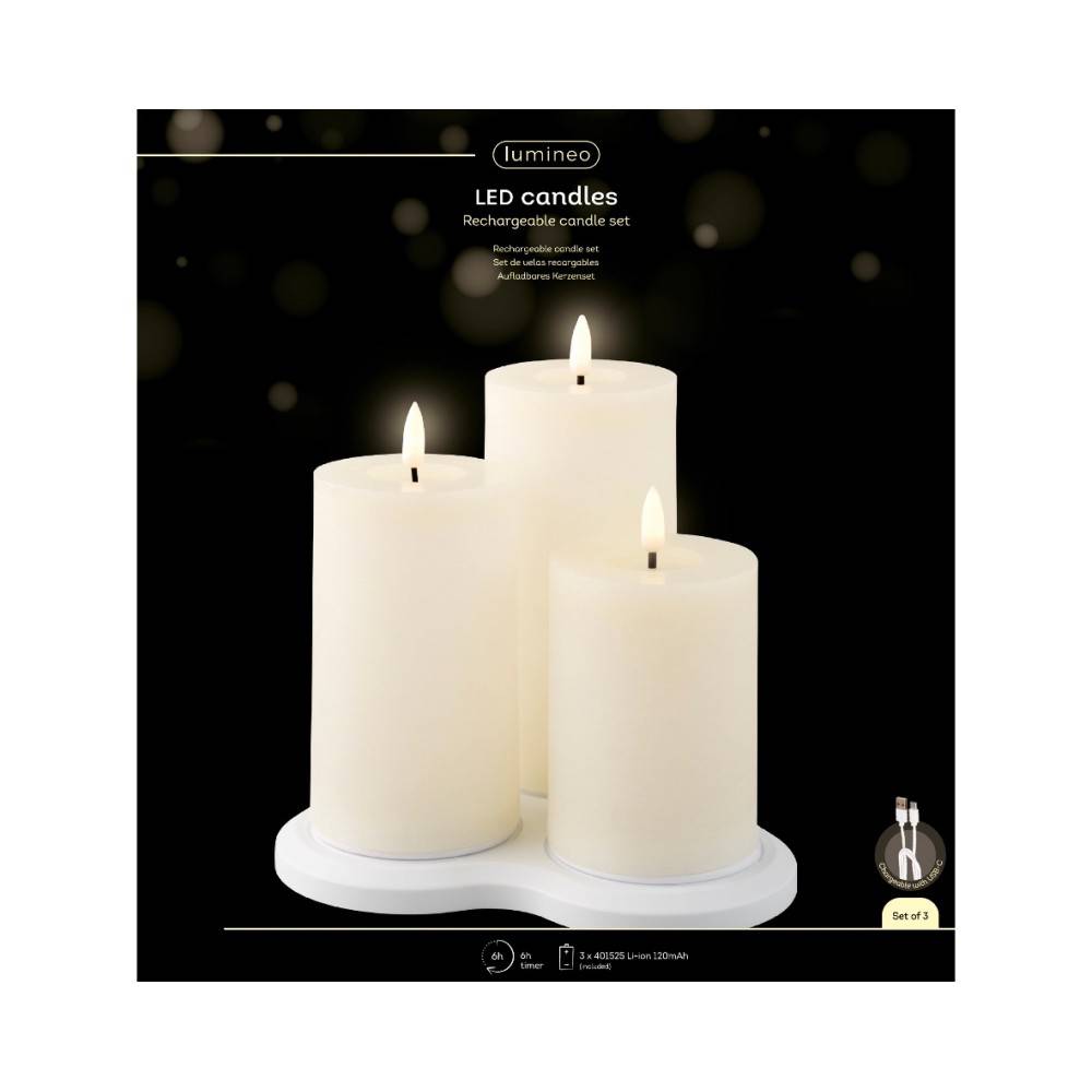A serene set of three white LED candles on a circular base, mimicking real flames.