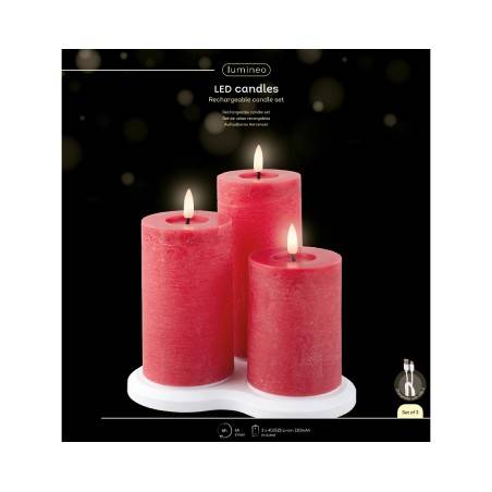 Three red LED candles with flames, set on a white base, against a dark background.
