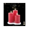 Three red LED candles with flames, set on a white base, against a dark background.
