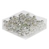 A cluster of shiny silver balls arranged on a clear plastic sheet.