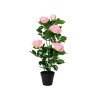 A decorative potted plant with pink roses and green leaves in a black pot.