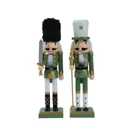 Two colorful nutcracker figurines in green and white uniforms, one holding a sword, the other a s... Two colorful nutcracker figurines in green and white uniforms, one holding a sword, the other a s...
