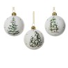 Three white Christmas ornaments featuring snowy tree designs and gold accents.