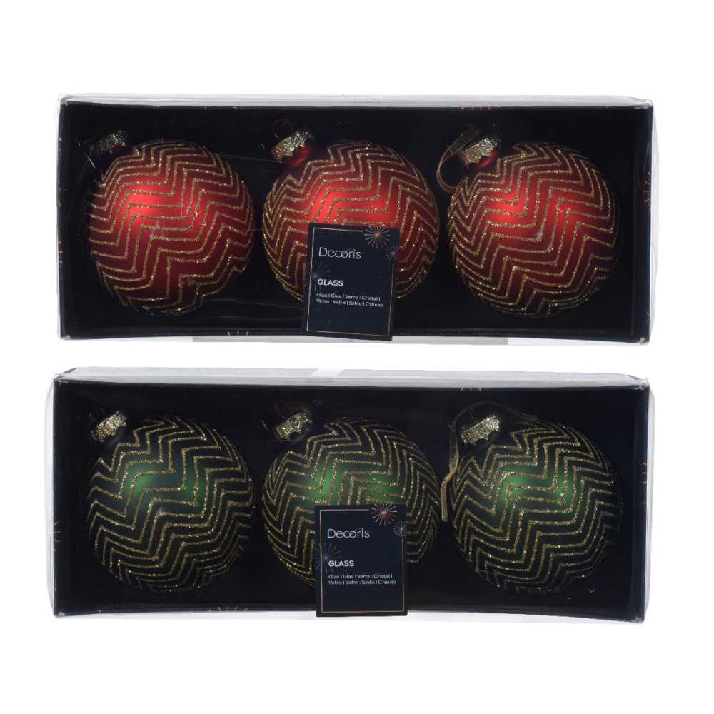 Two sets of glass Christmas ornaments in red, green, and black with zigzag patterns.